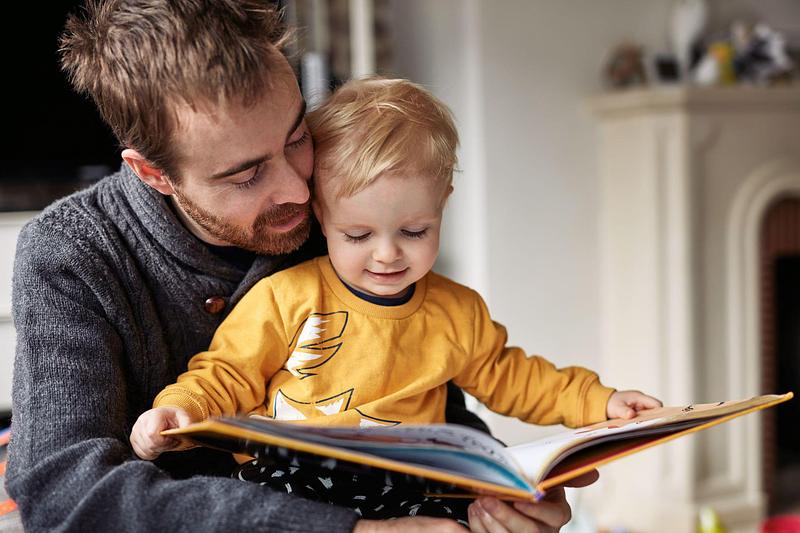 Decorative image - dad reading to son